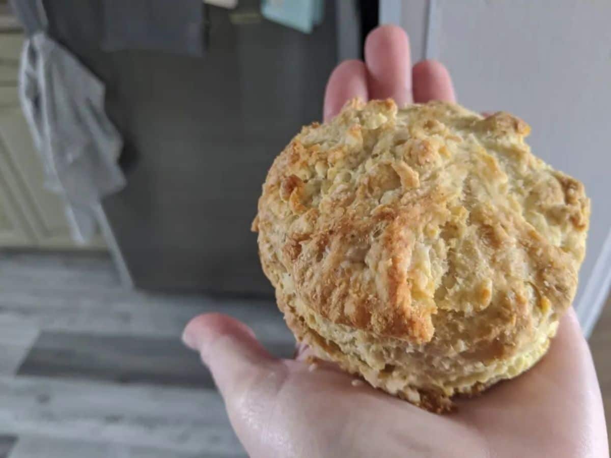 Grandma's sourdough biscuit on the palm of the hand.