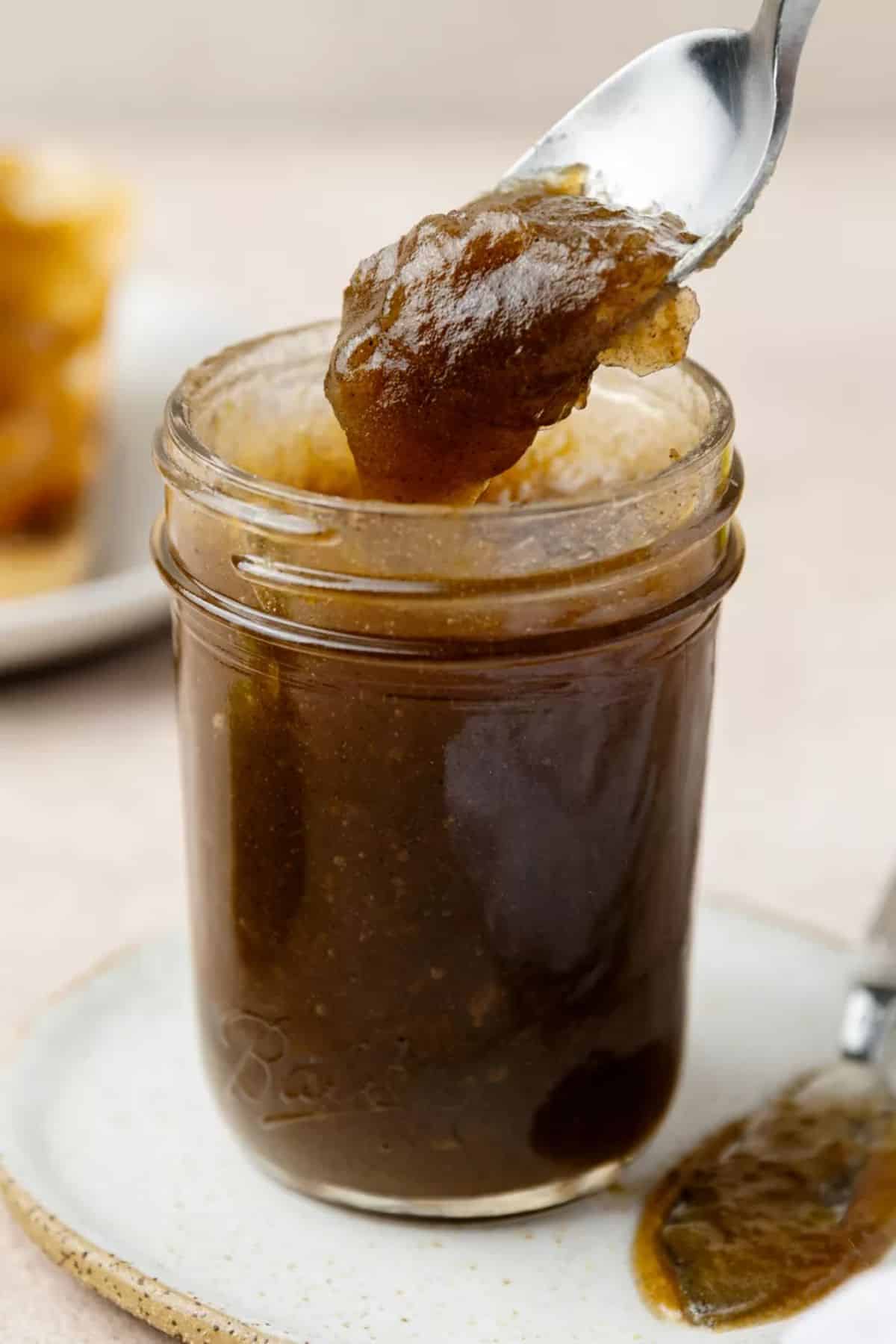 Delicious apple butter in a glass jar.