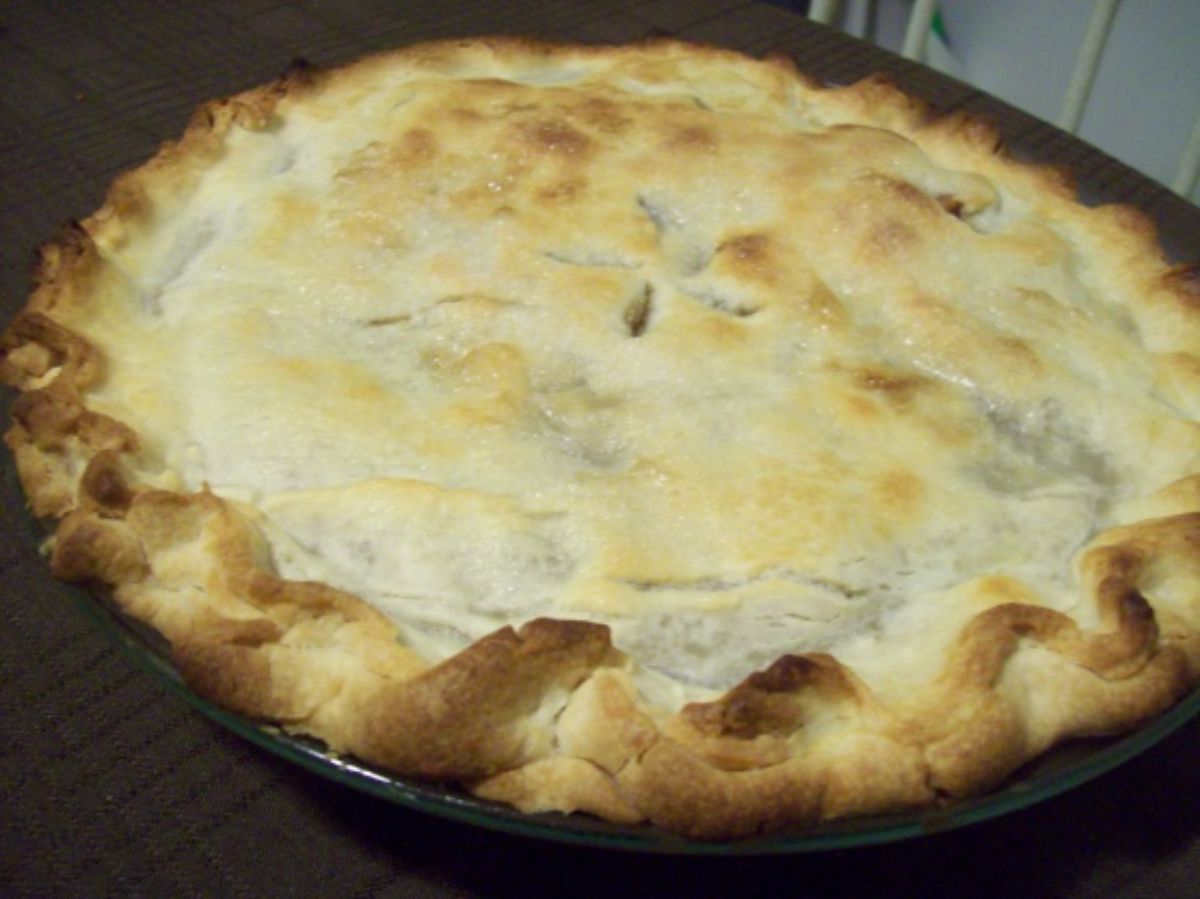 Dried apple pie in a tray.