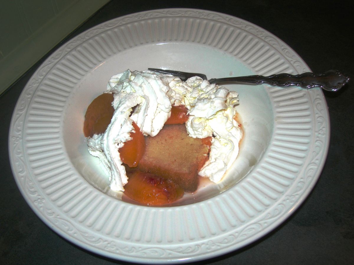 A piece of sarah's pound cake recipe on a white plate with a fork.