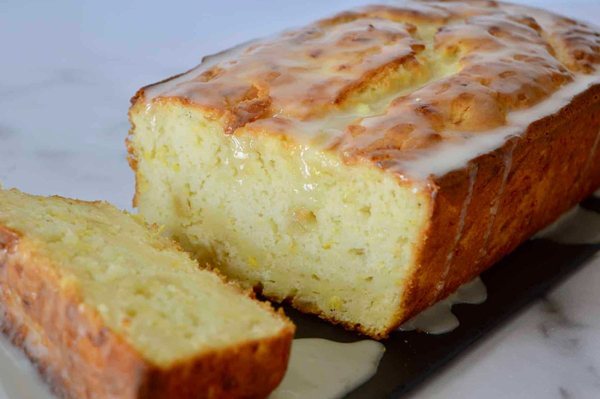 Partially sliced lemon summer squash bread.