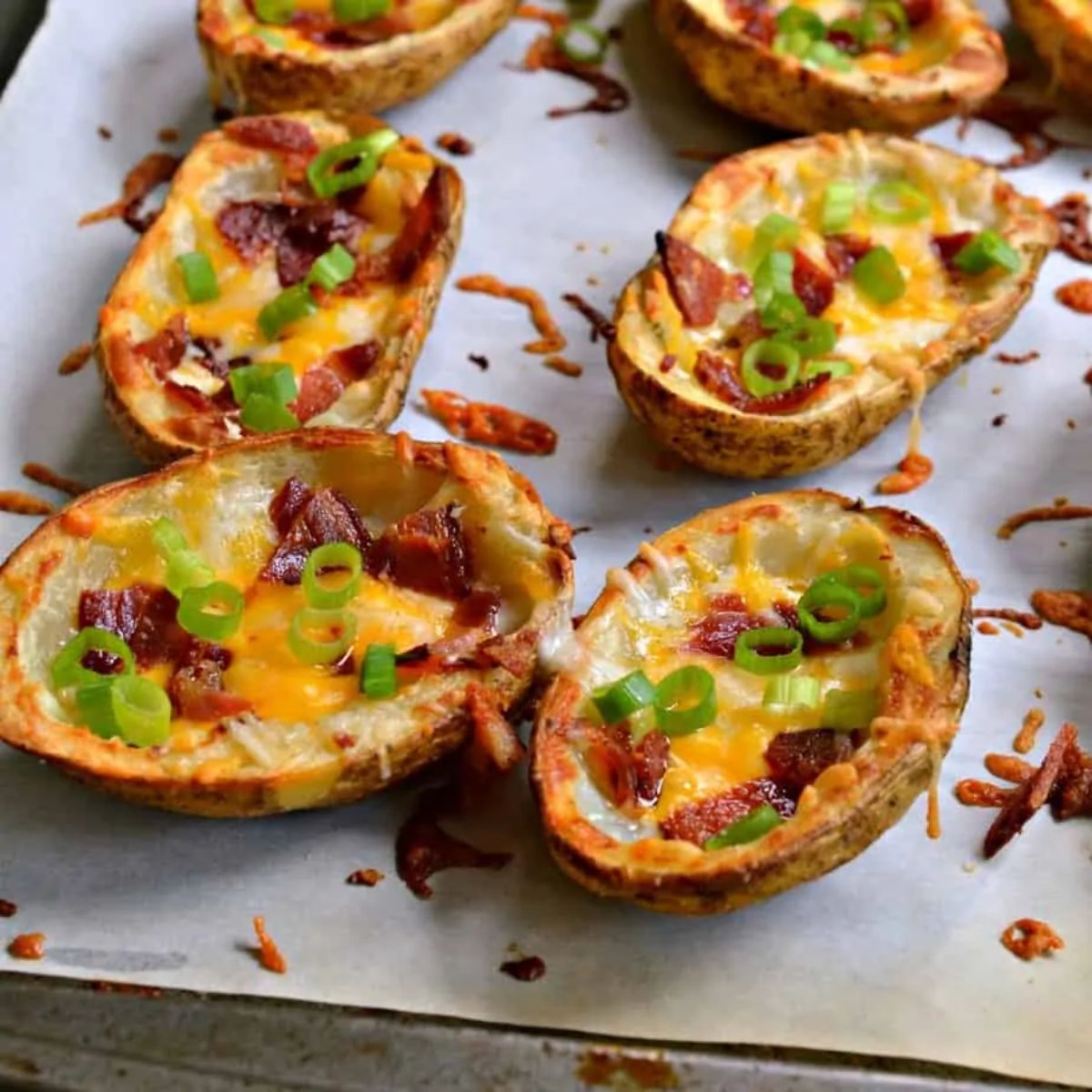 Crispy potato skins on parchment paper.