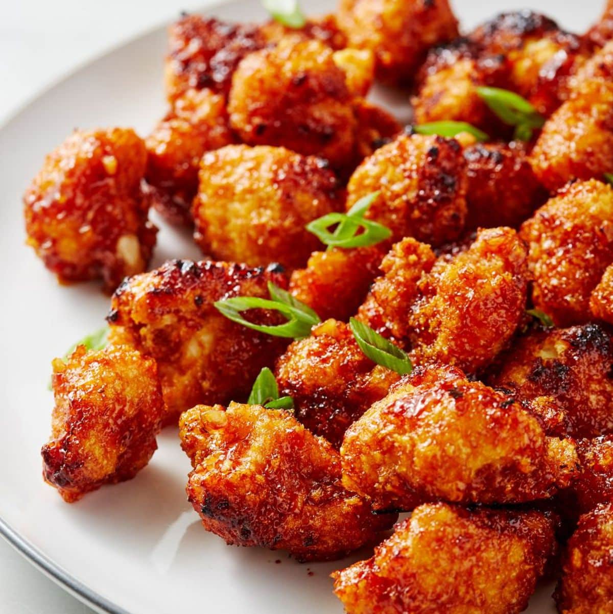 Crunchy honey-garlic cauliflower on a white plate.