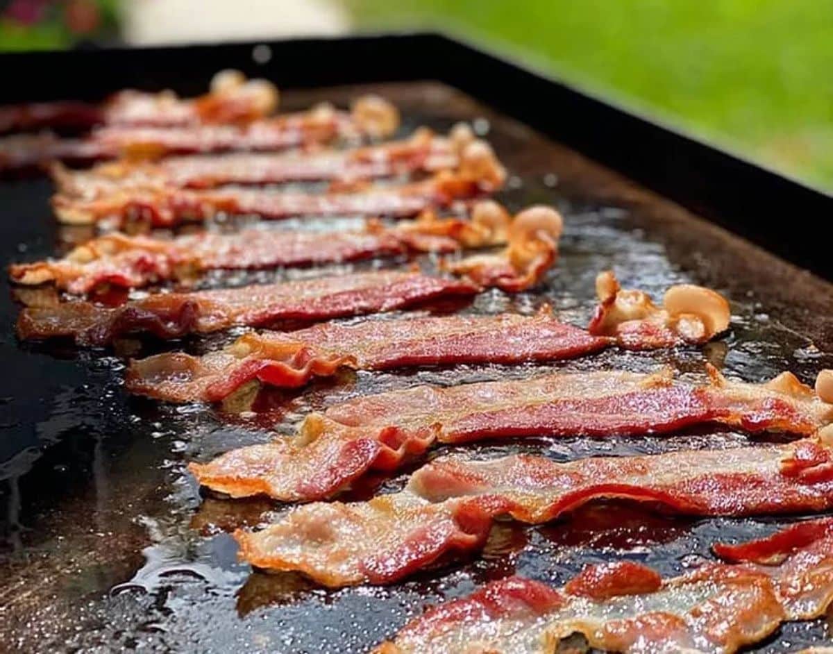 Slices of bacon on a griddle