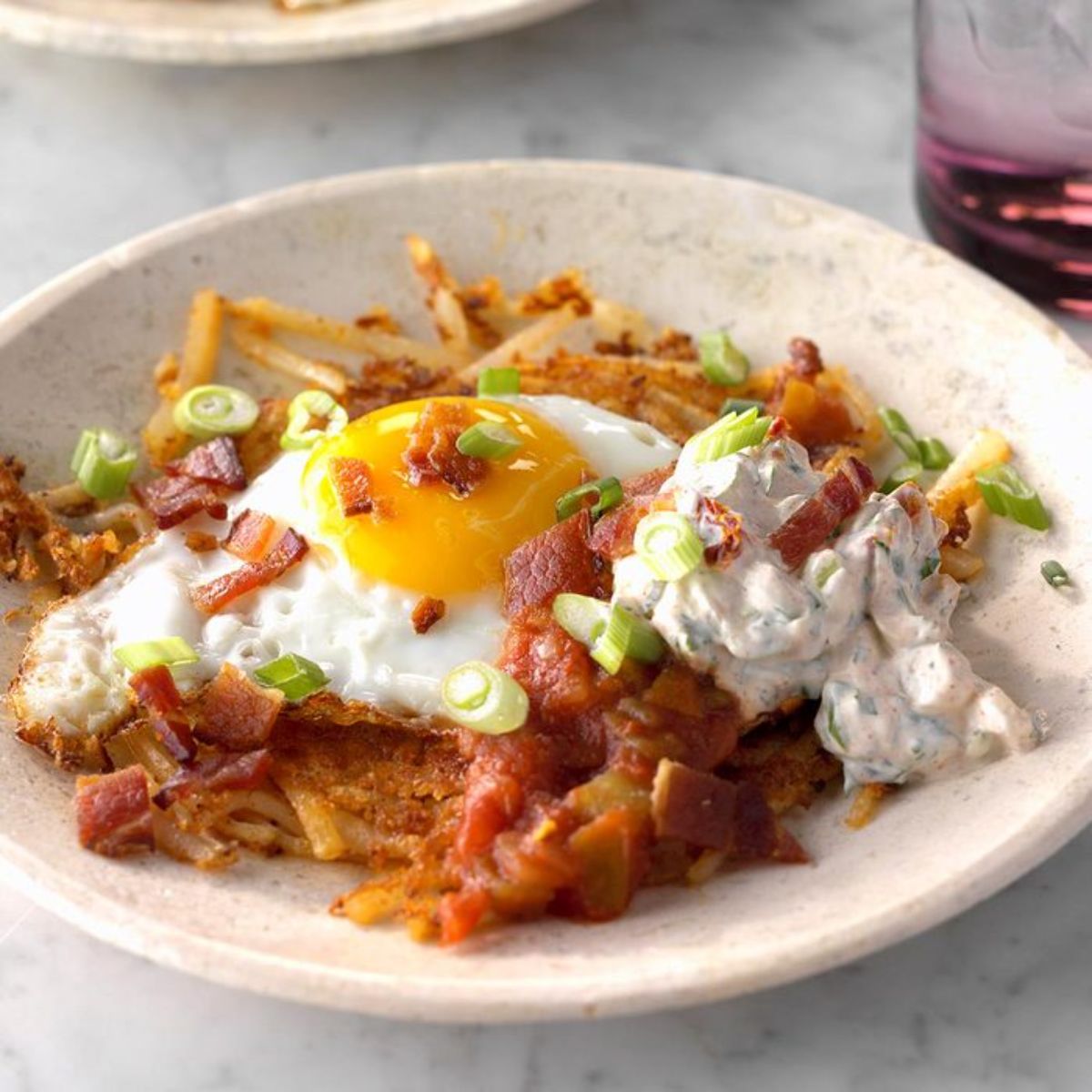 Tex-mex breakfast haystacks on a white palte.