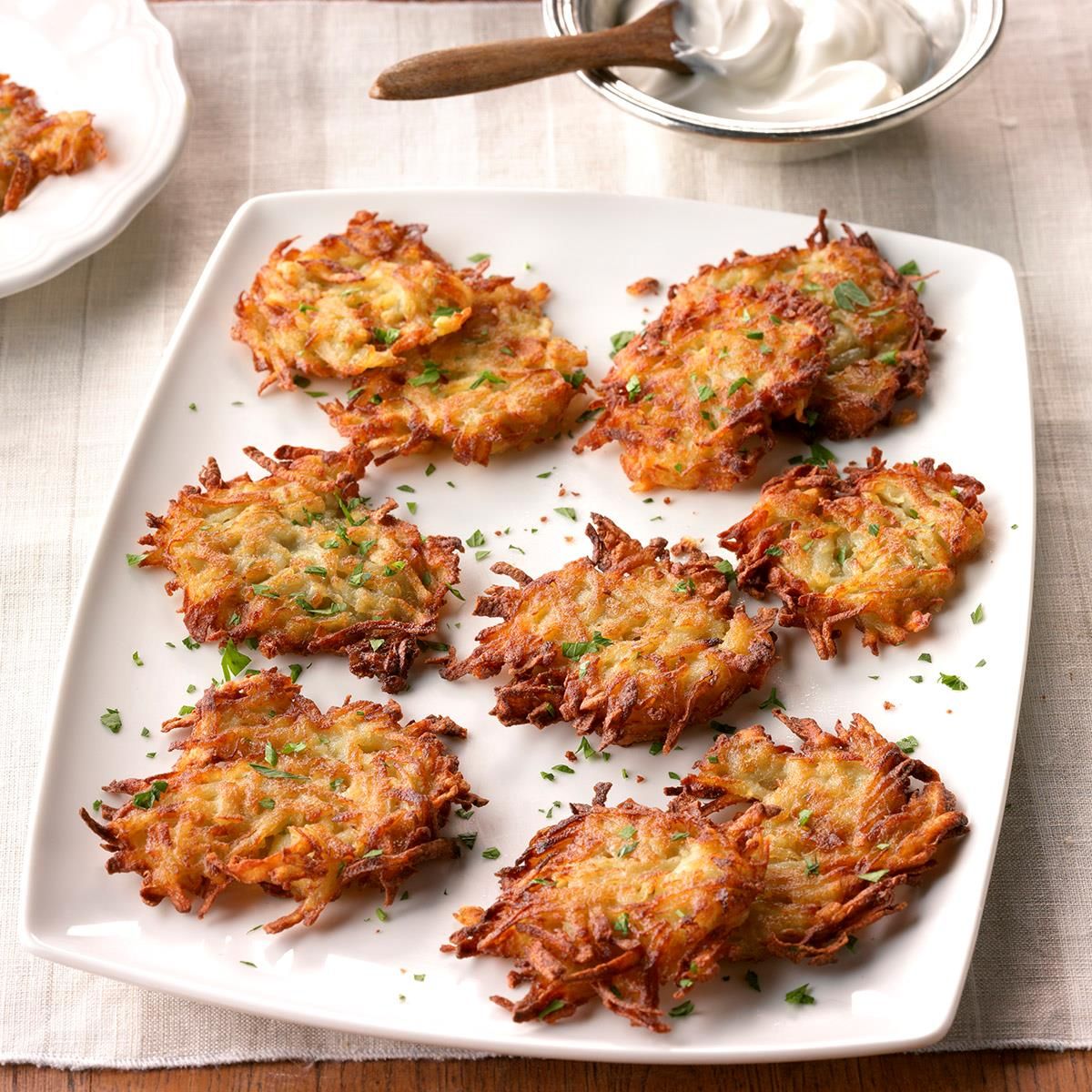 Country potato pancakes on a white tray.