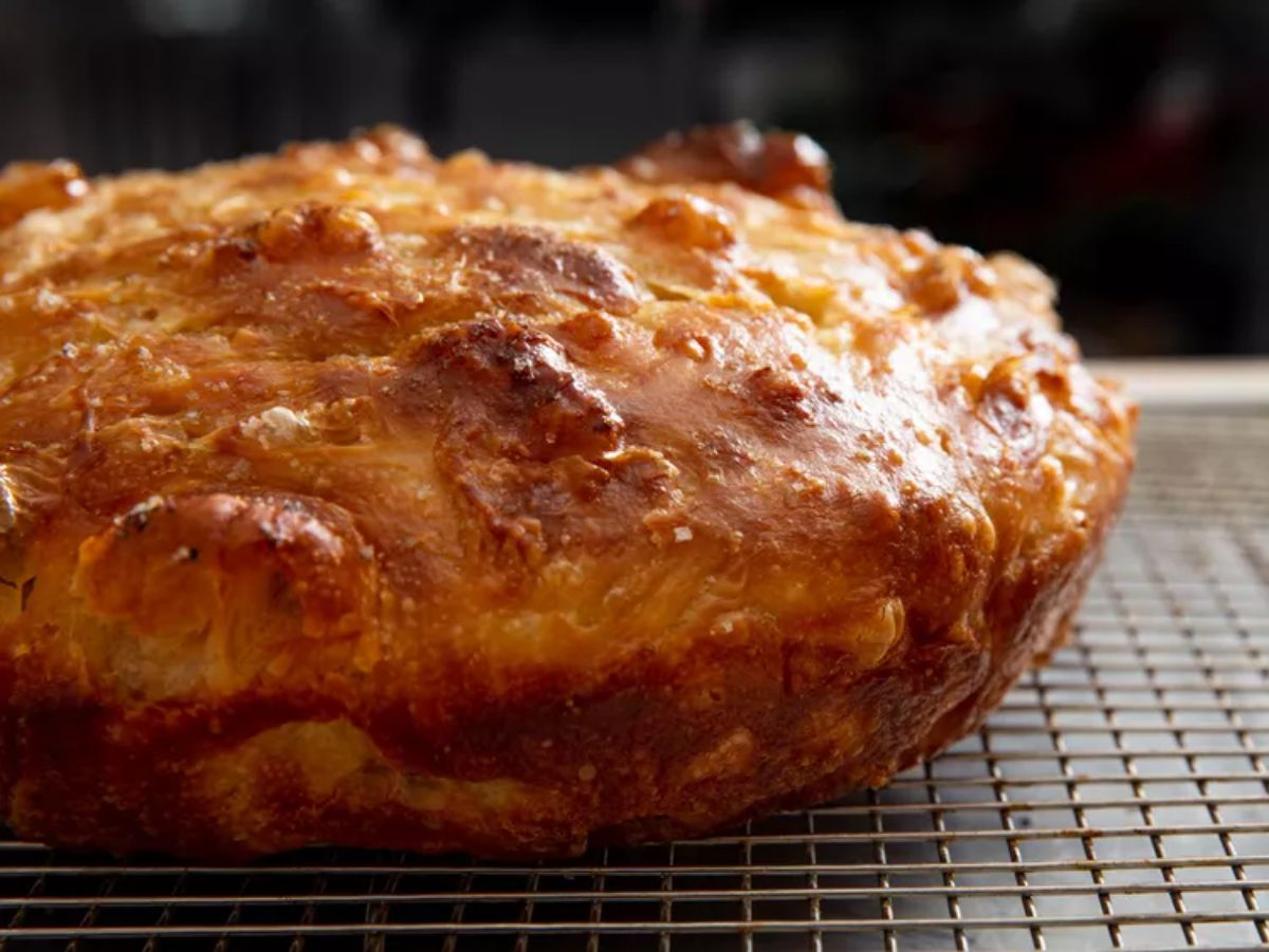 Delicious lard focaccia on a resting grid.