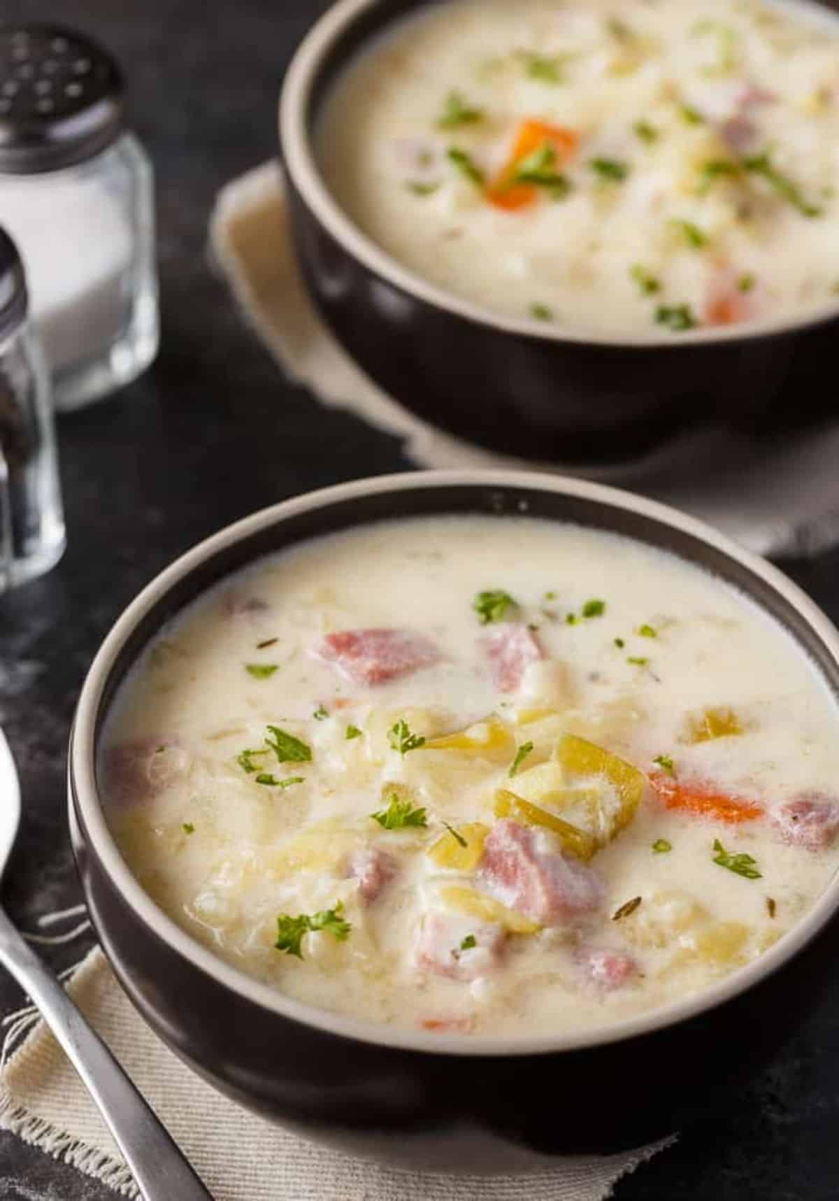 Healthy cabbage chowder in a black bowl.