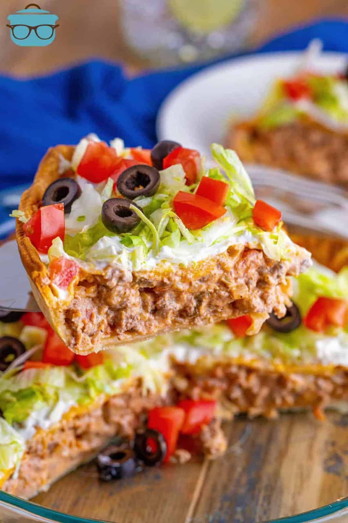 A piece of taco pie on a spatula.