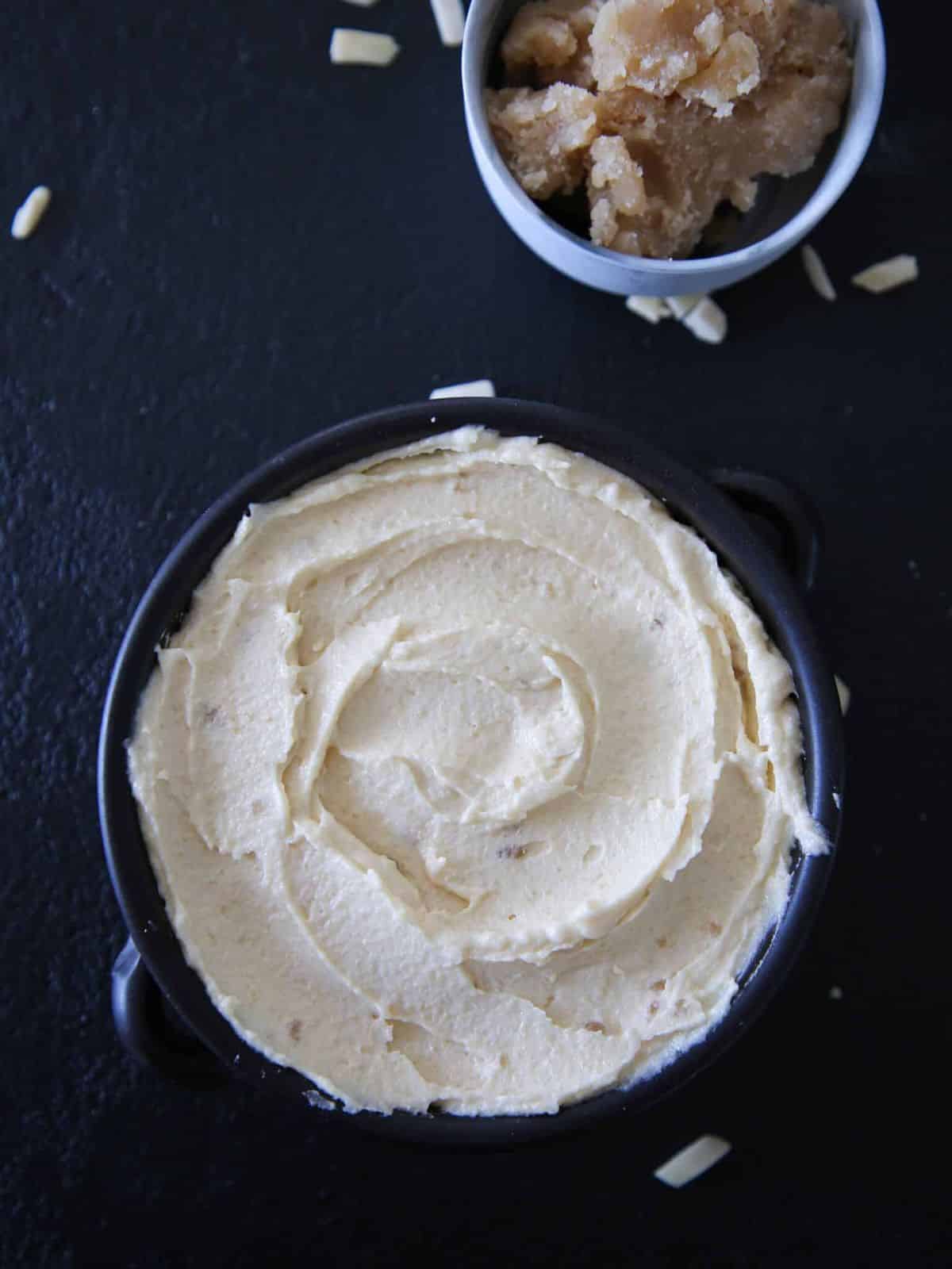 Almond cream with almond paste in a blue bowl.