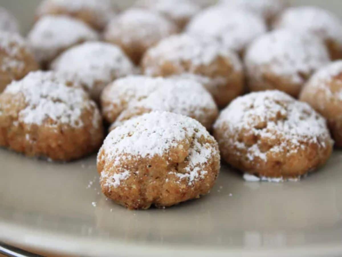 Delicios spanish lard cookies (polvorones) on a gray tray.