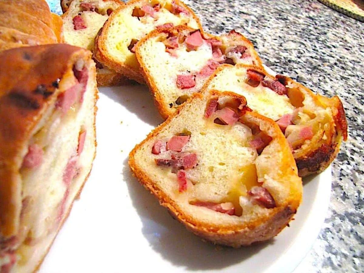 Hirshon - italian flag lard bread partially sliced on a white tray.