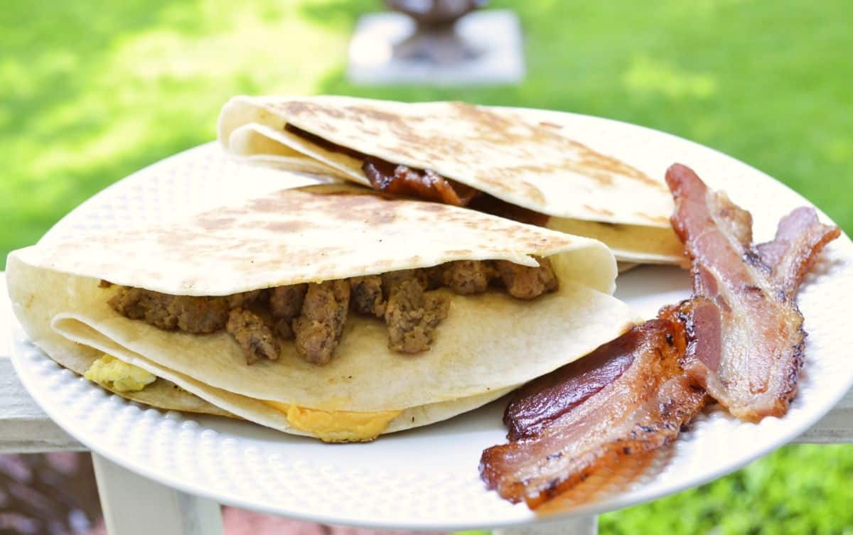 Blackstone folded breakfast quesadillas on a white plate.