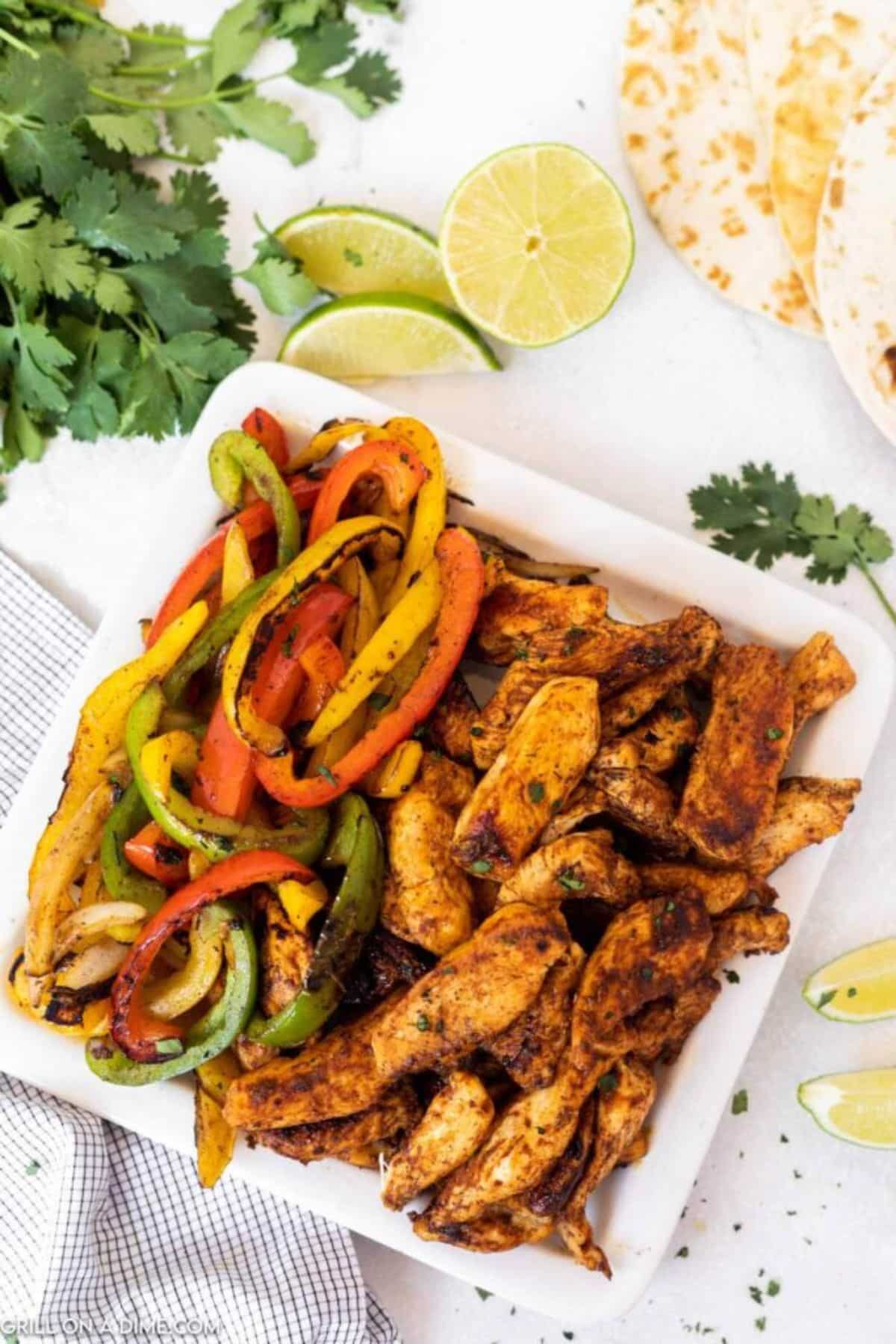 Blackstone chicken fajitas in a white bowl.