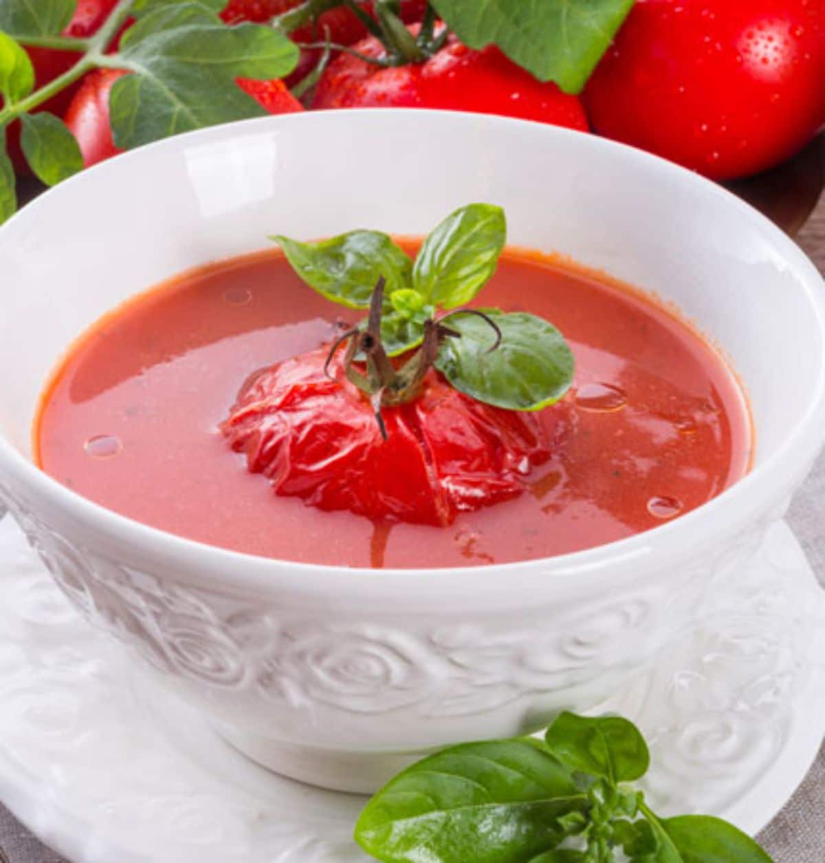 Canned spiced tomato soup in a white bowl.