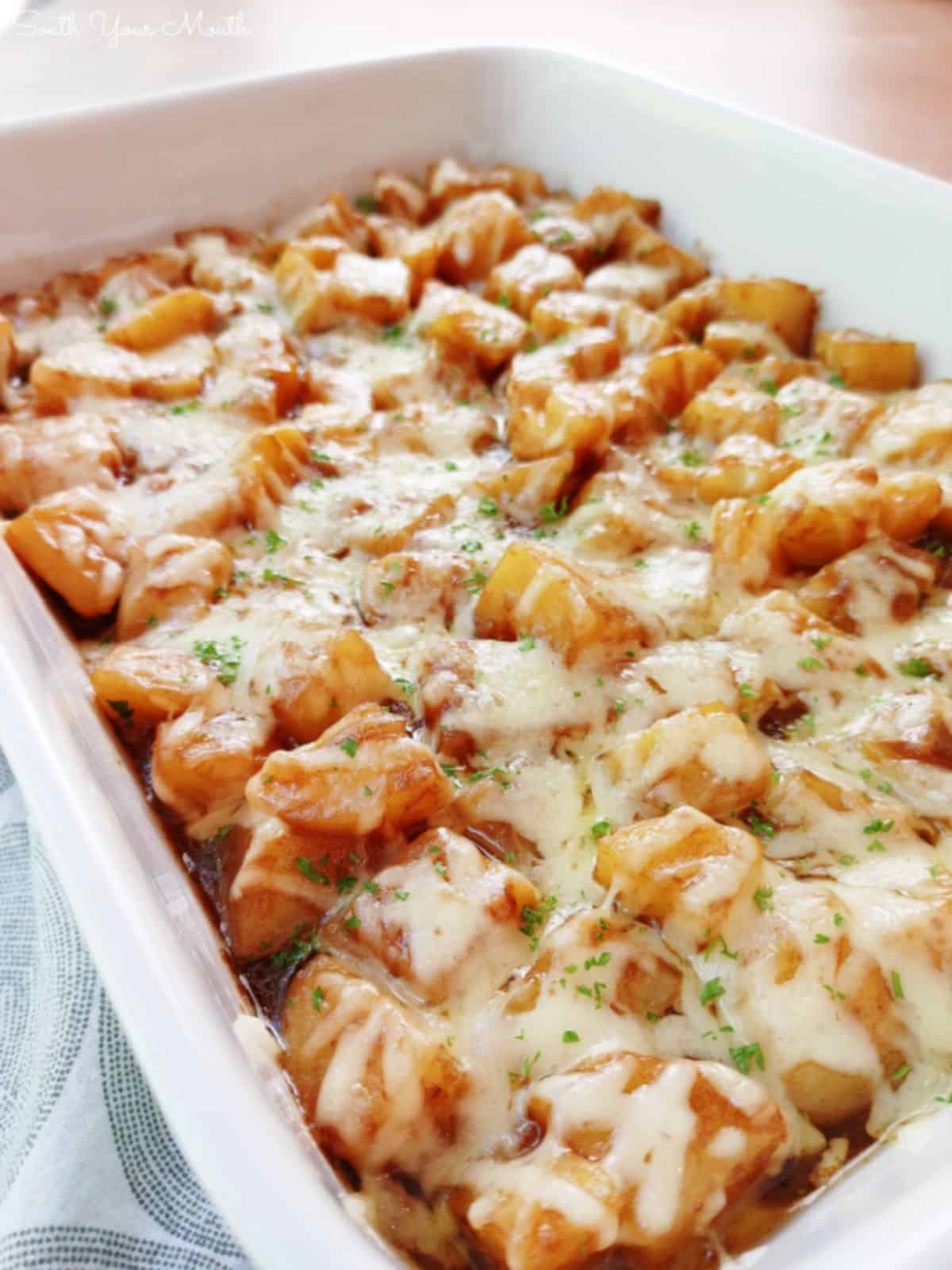 French onion potatoes in a white casserole.