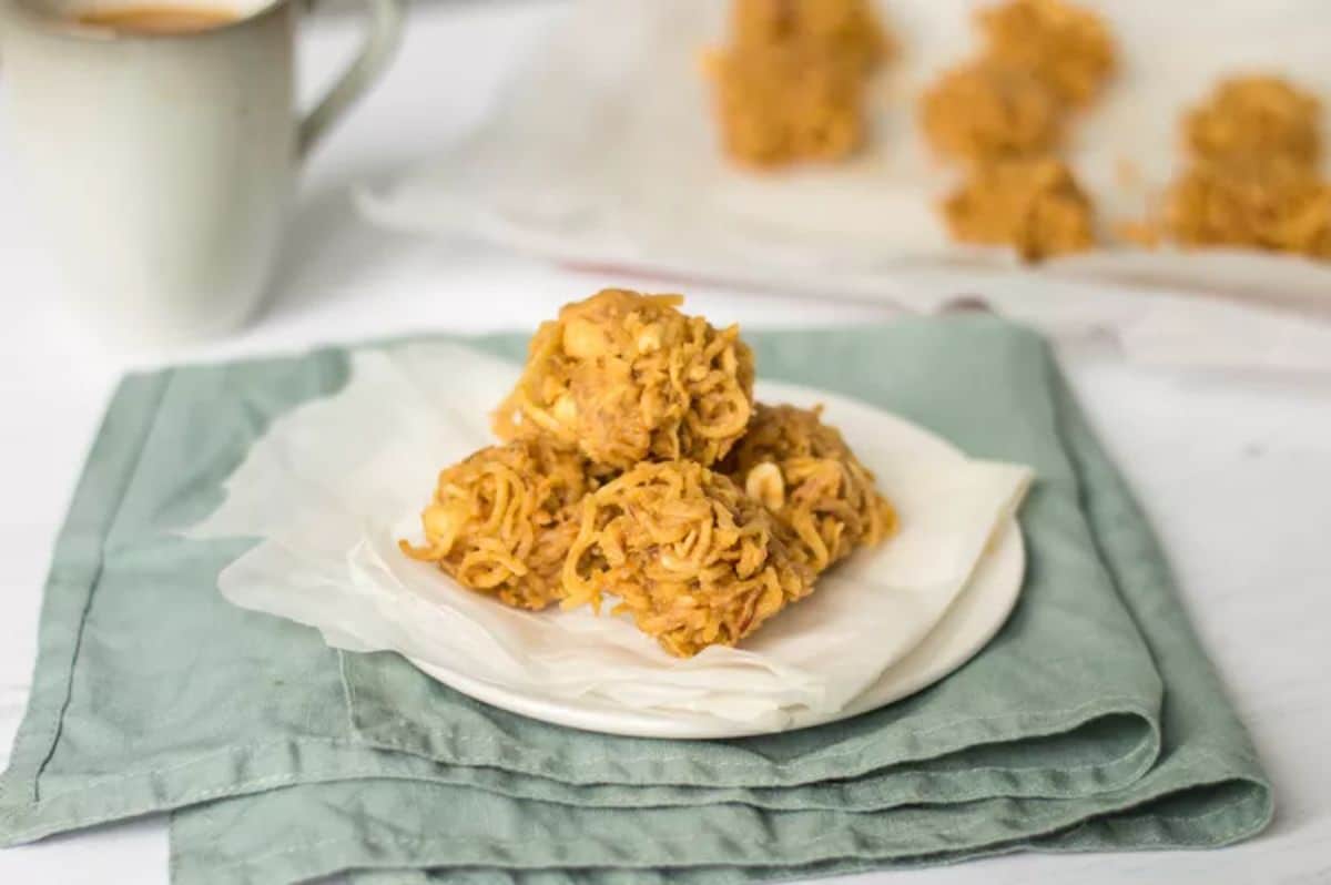 Crunchy peanut butter and butterscotch haystacks on a white plate.