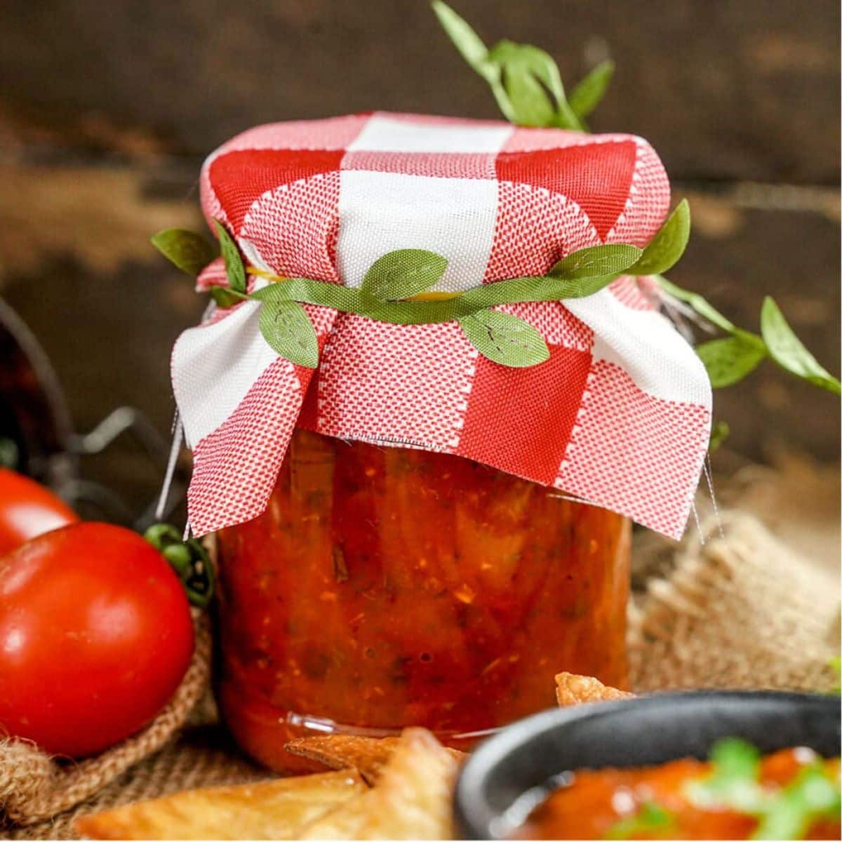 Canned salsa in a glass jar.