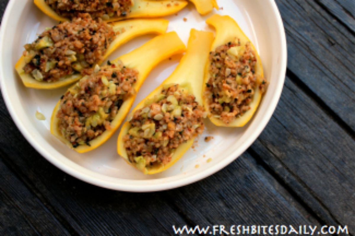 Easy stuffed yellow squash on a white tray.