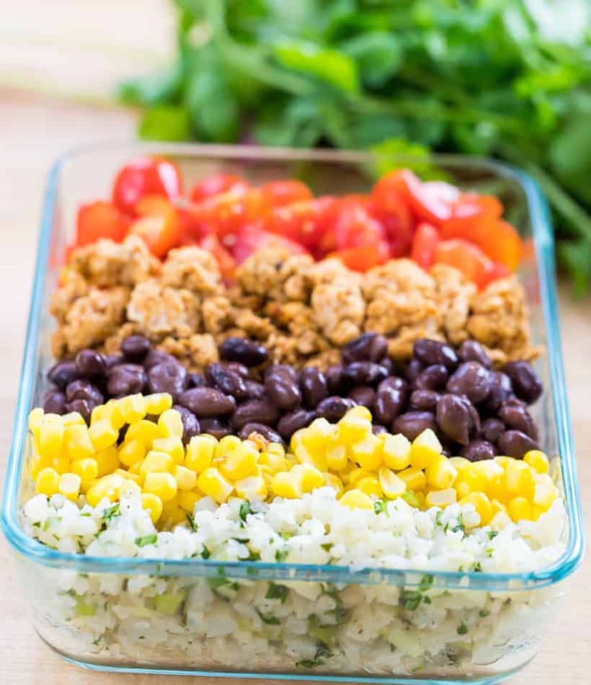 Scrumptious chicken burrito in a glass bowl.