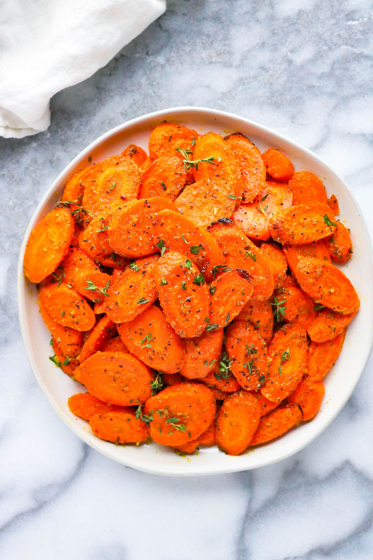 Easy ranch roasted carrots on a white plate.