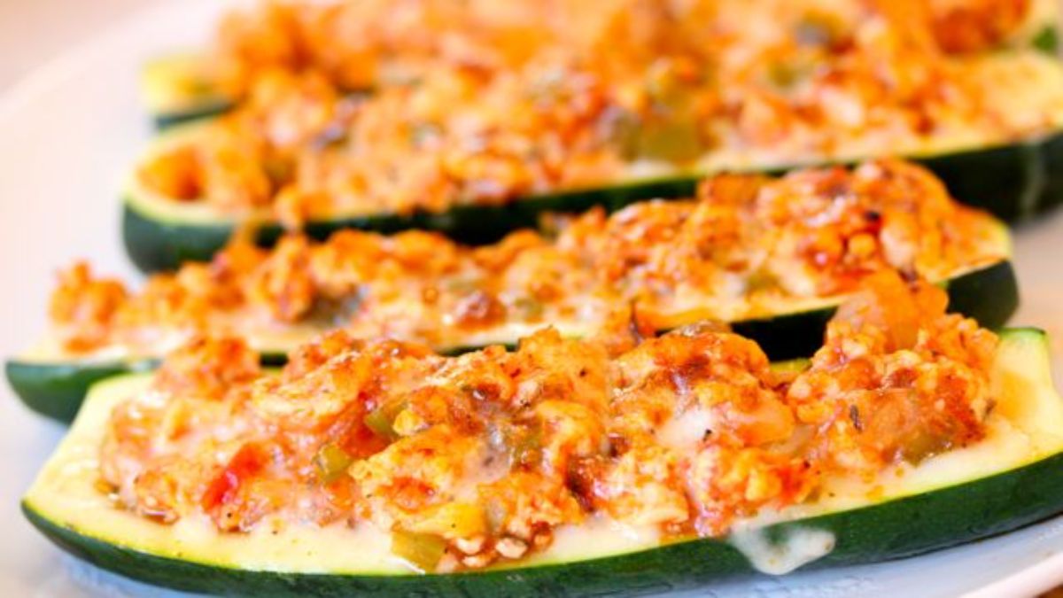 Scrumptious turkey zucchini boats on a white tray.