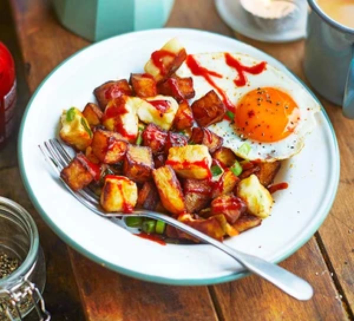 Halloumi hash with a fork on a plate.