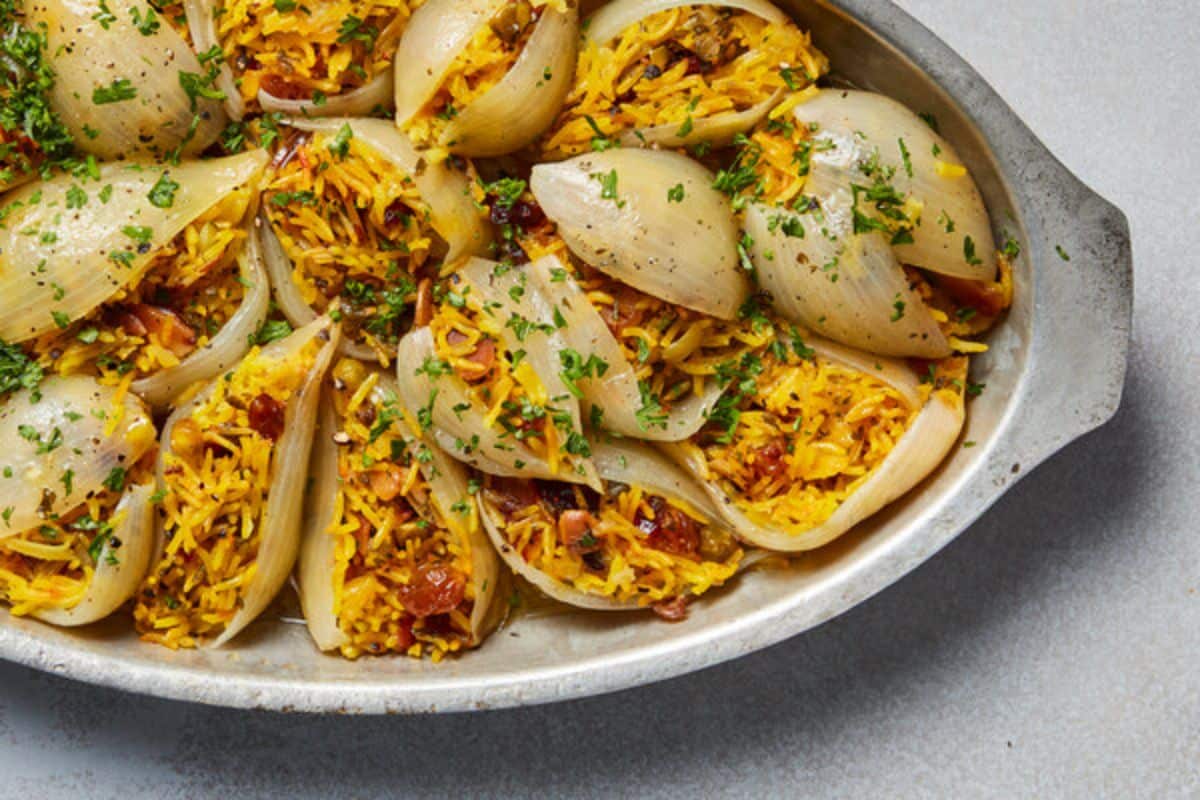Delicious stuffed onions on a metal tray.