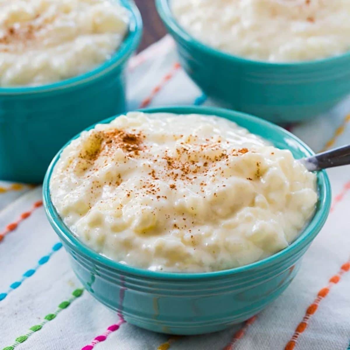 Delicious rice pudding in a blue bowl.