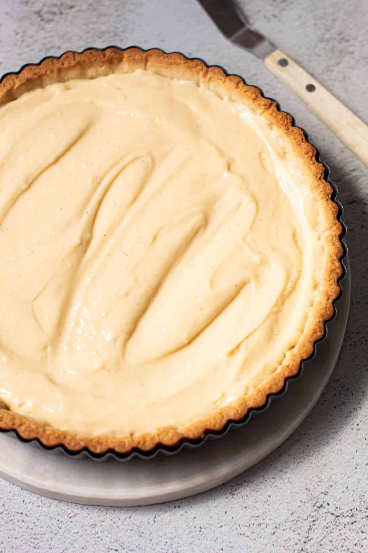 Yummy cream custard tart in a baking tray.