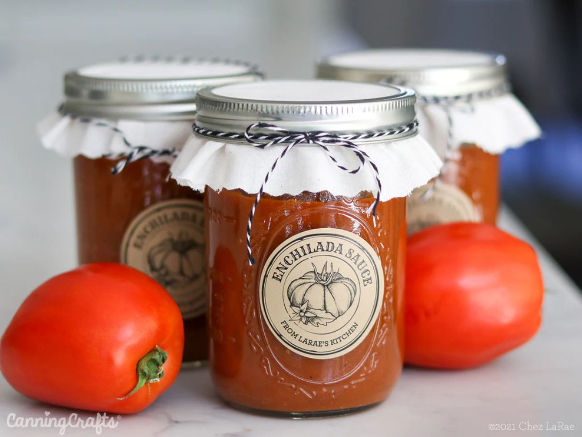 Canned enchilada sauce in glass jars.