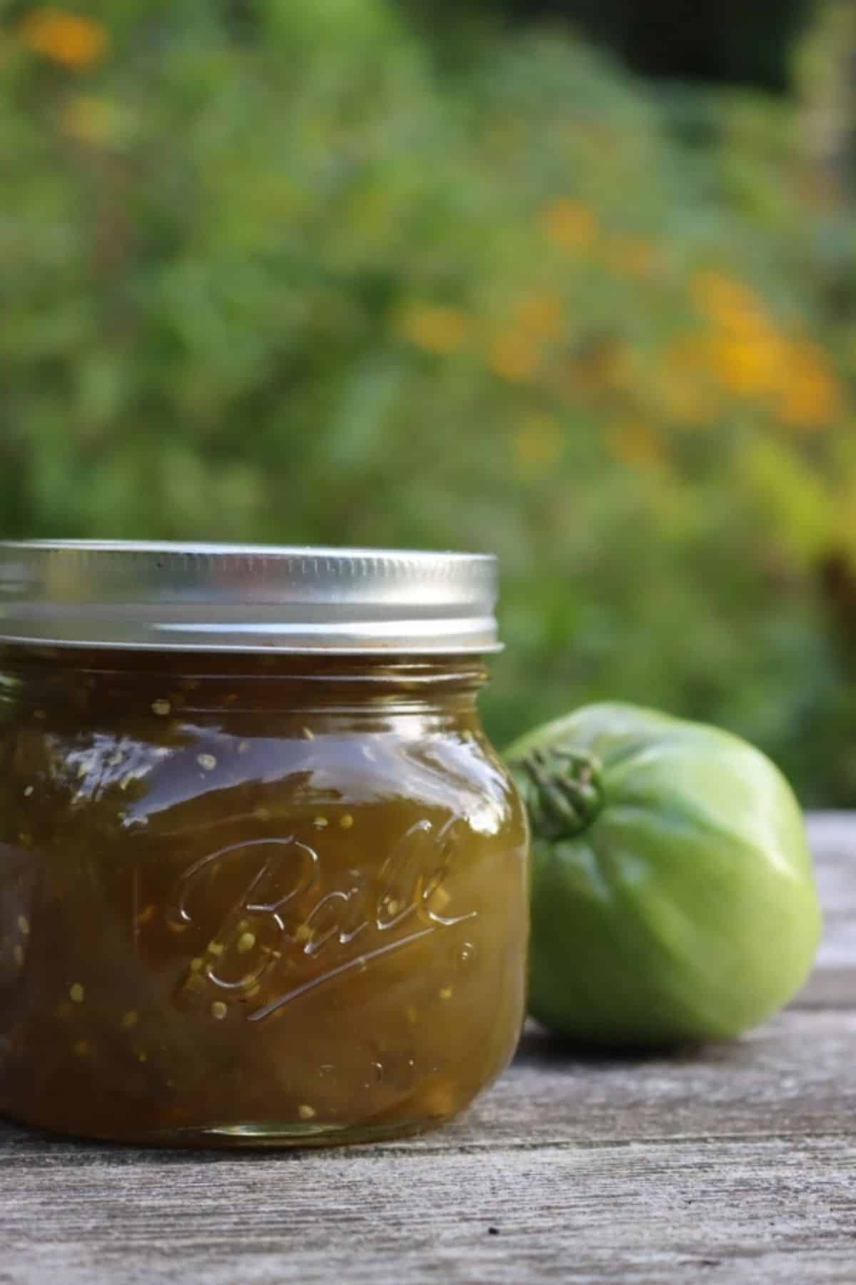 Old- fashioned green tomato jam canned in a glass jar.