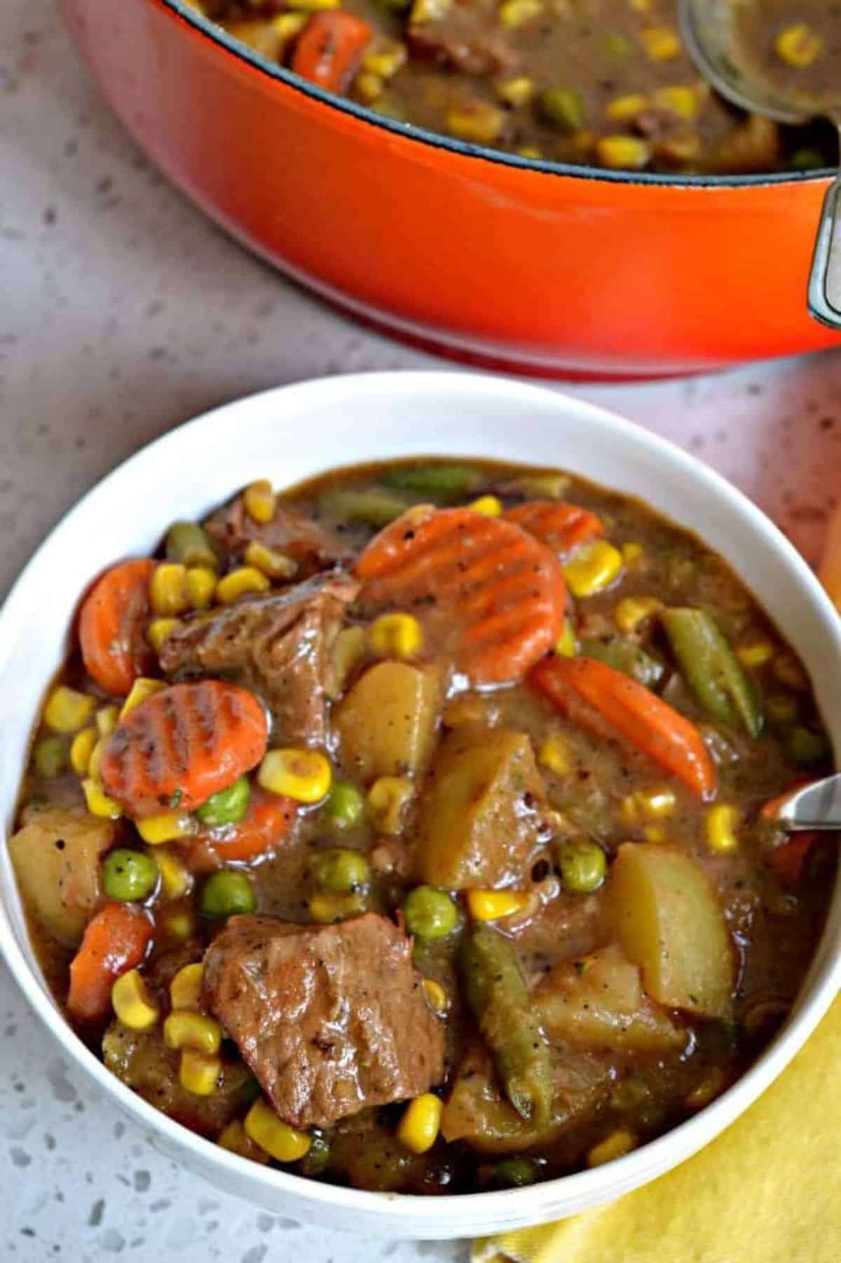 Healthy mulligan stew in a white bowl.