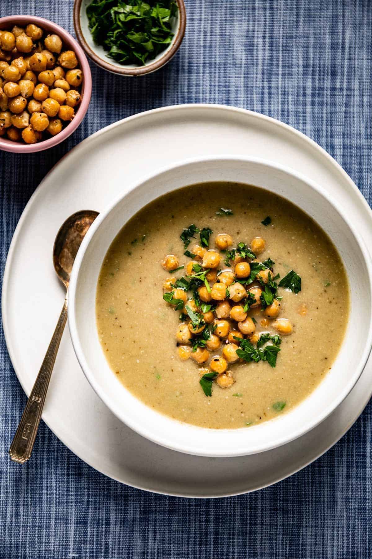 Healthy roasted eggplant soup in a white bowl.