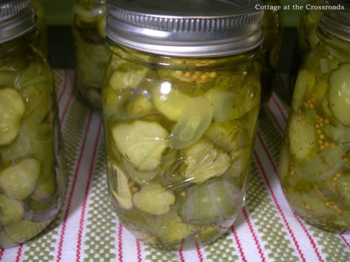 Bread and butter pickles in glass jars.