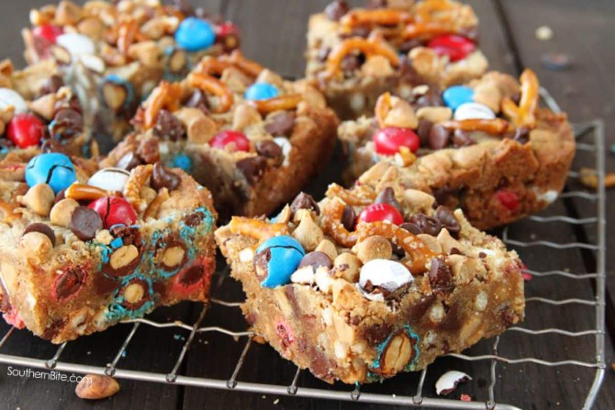 Sweet & salty monster bar cookies on a resting grid.