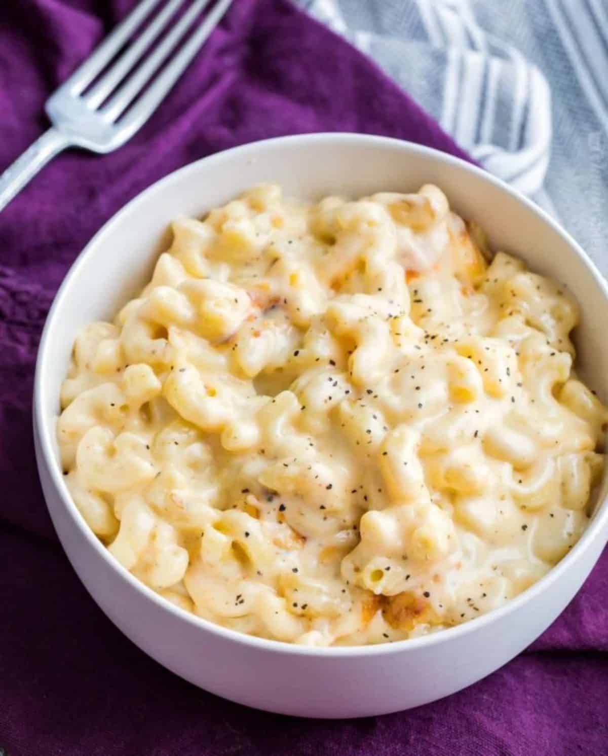Delicious macaroni and cheese in a white bowl.