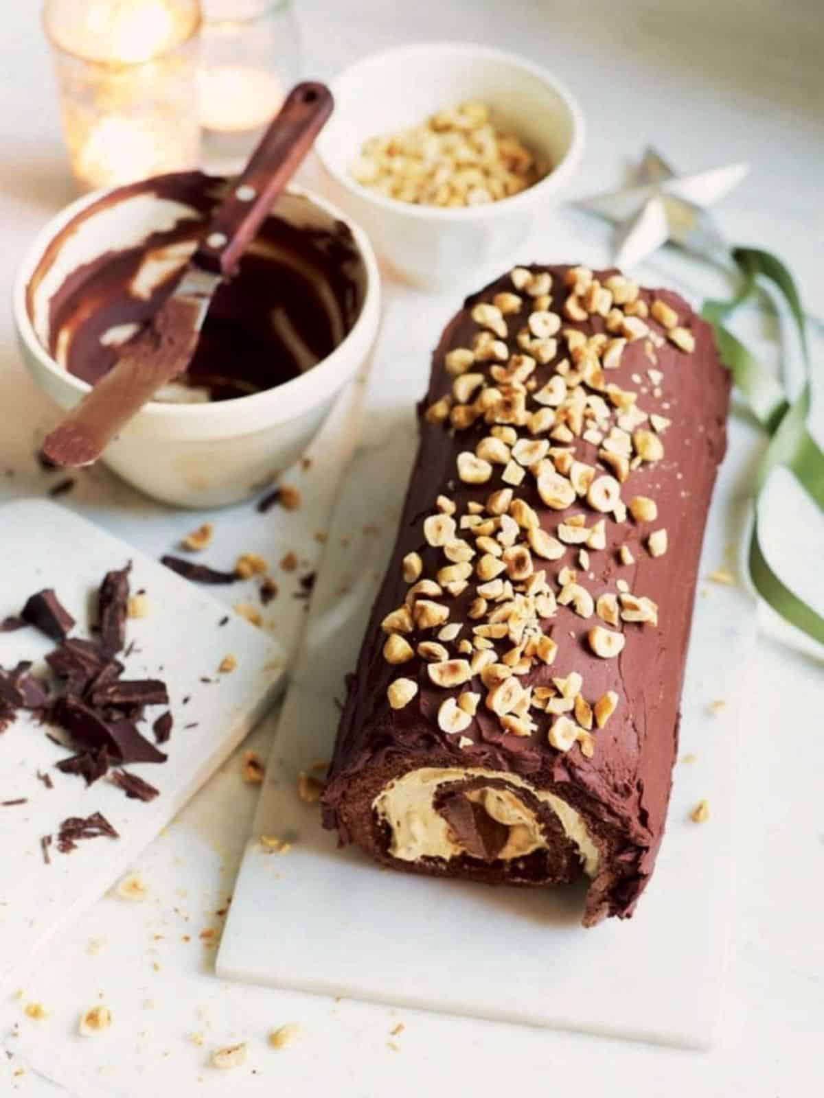 Scrumptious salted caramel swiss roll on a white tray.