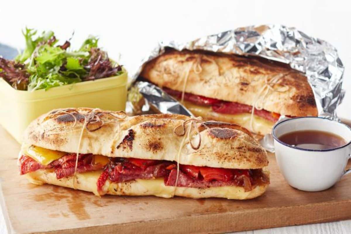 Campfire sandwiches on a wooden cutting board.