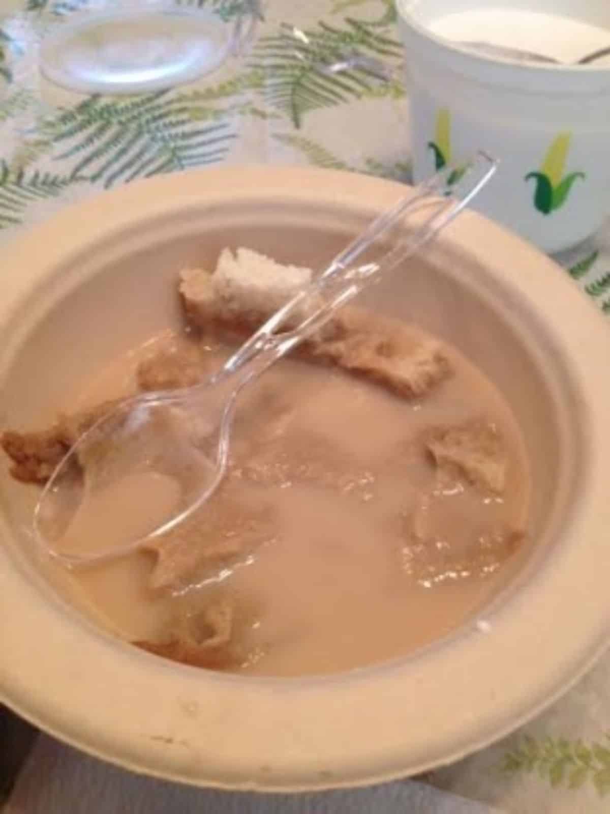 Delicious coffee soup in a gray bowl with a plastic spoon.