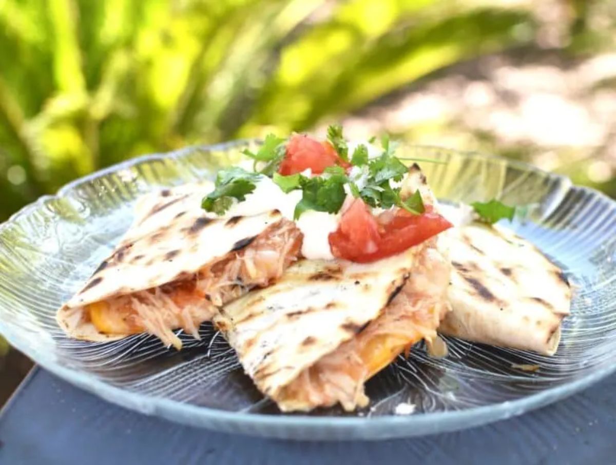 Chicken quesadillas on a glass plate.
