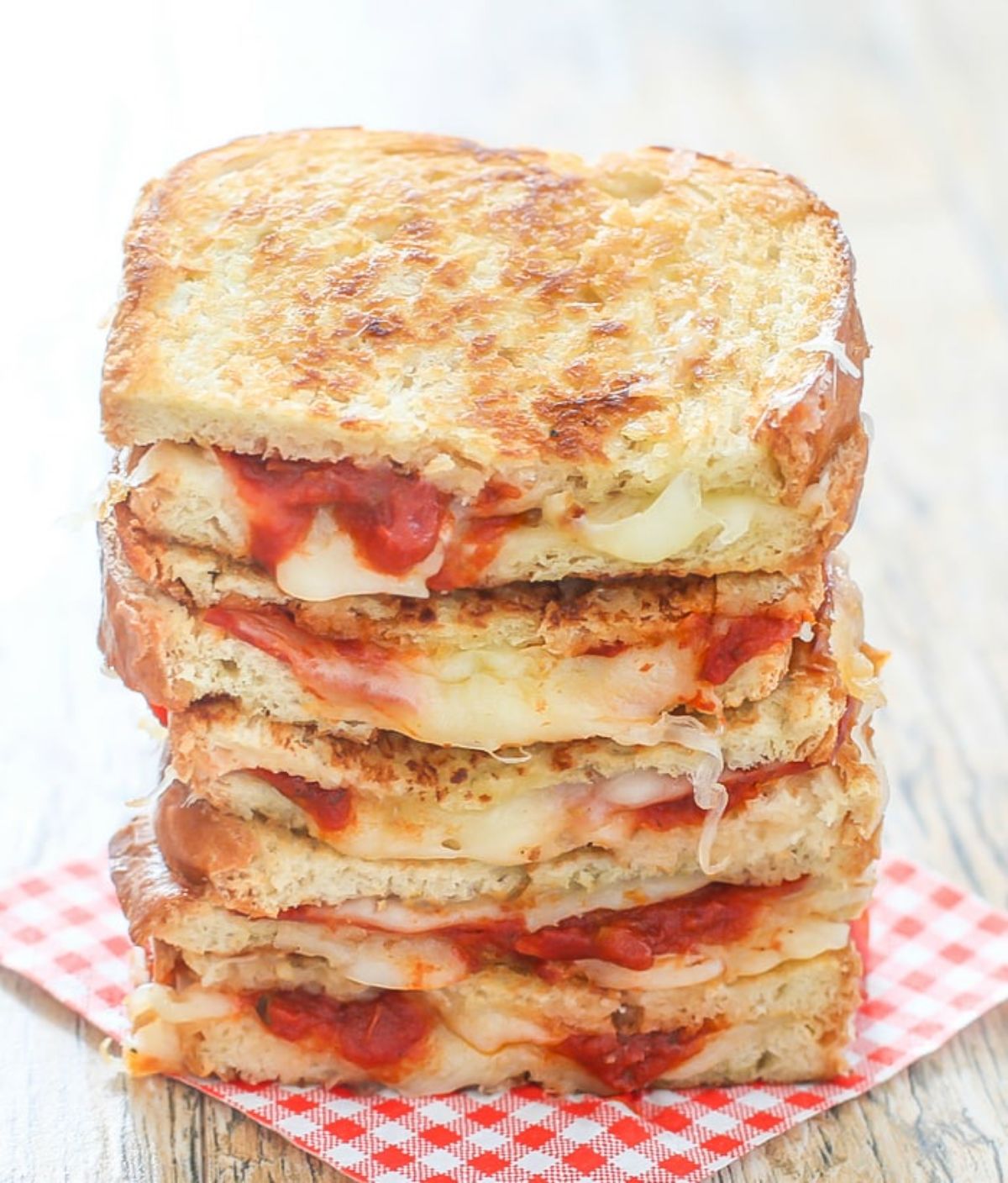 A pile of pizza grilled cheese sandwiches