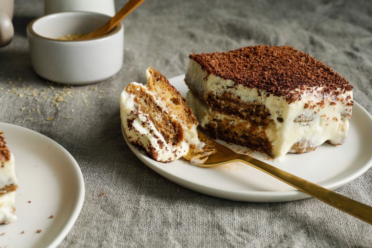 Scrumptious tiramisu on a white plate.