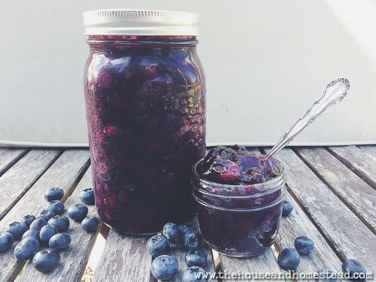 Blueberry pie filling canned in a glass jars.