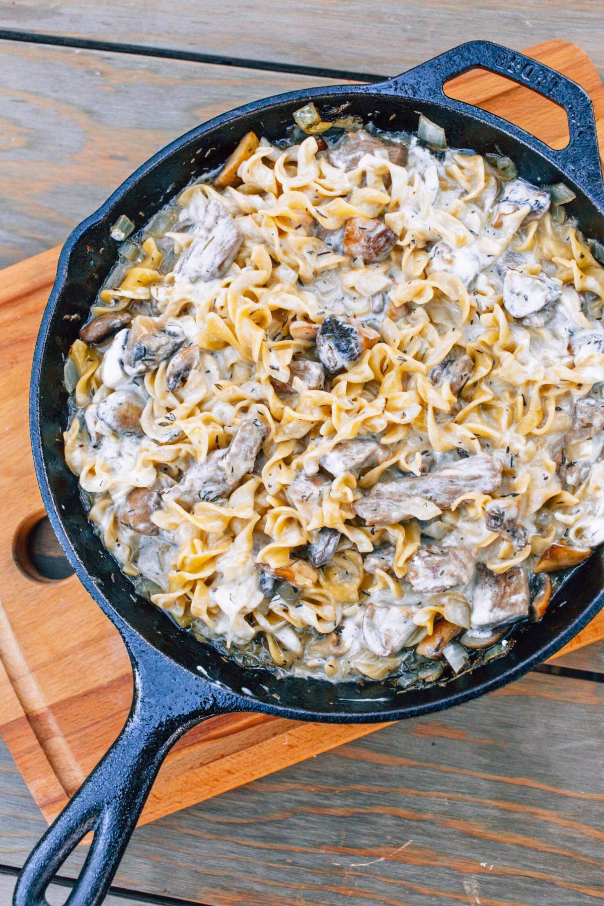 One-pot beef stroganoff in a black skillet.