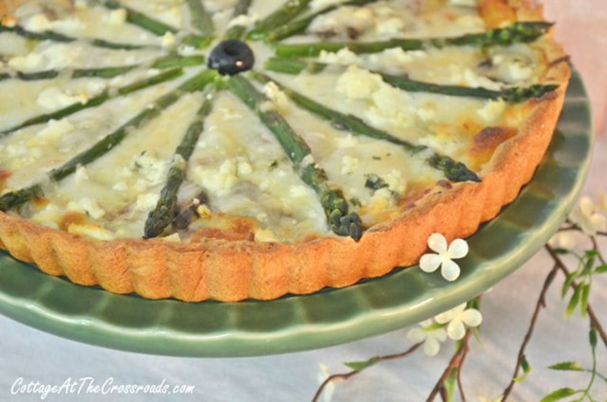 Delicious springtime asparagus tart on a cake tray.