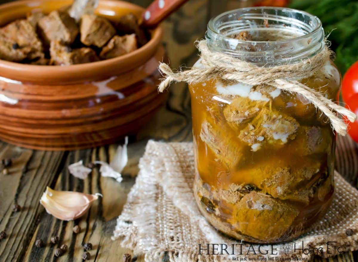 Beef tips and gravy in a glass jar.