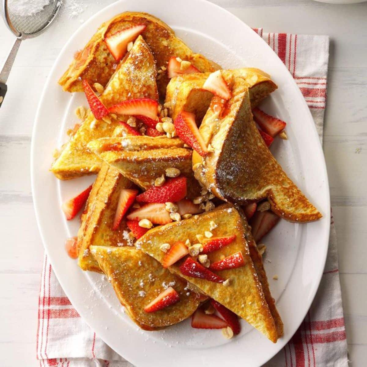 Pb&j french toast on a white tray.