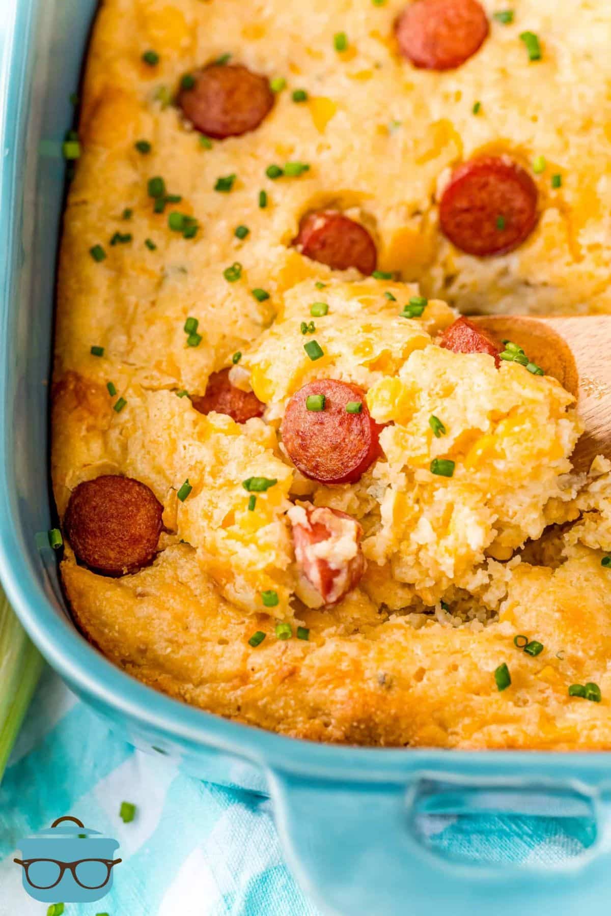 Delicious corn dog casserole in a blue casserole.