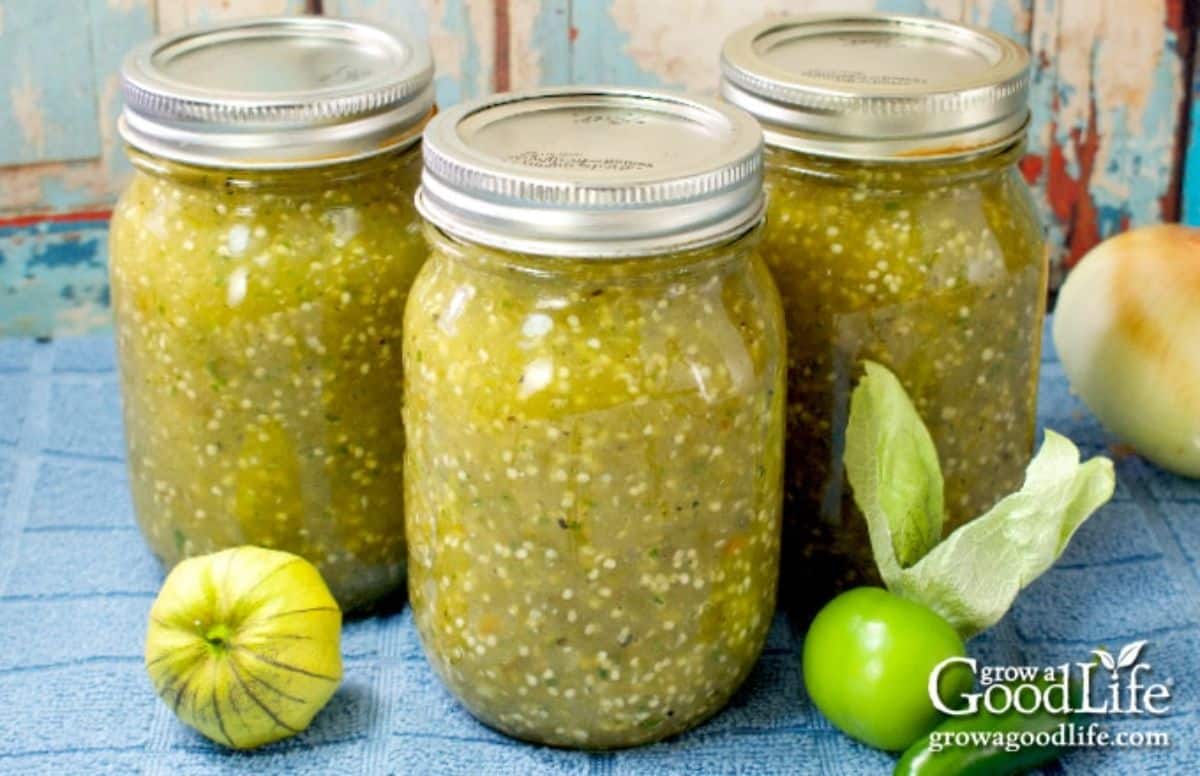 Roasted tomatillo salsa verde canned in glass jars.